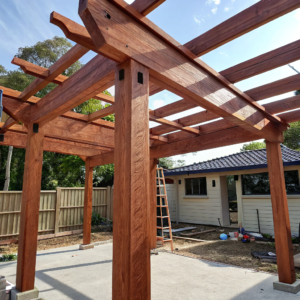 Merbau timber pergola frame being constructed in an Ipswich backyard